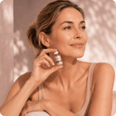 Woman holding Kina NAD+ vial — healthy aging