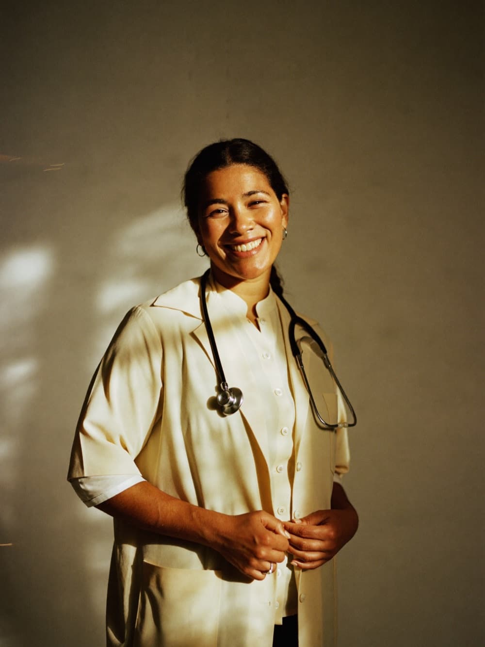 Licensed clinician in a white coat